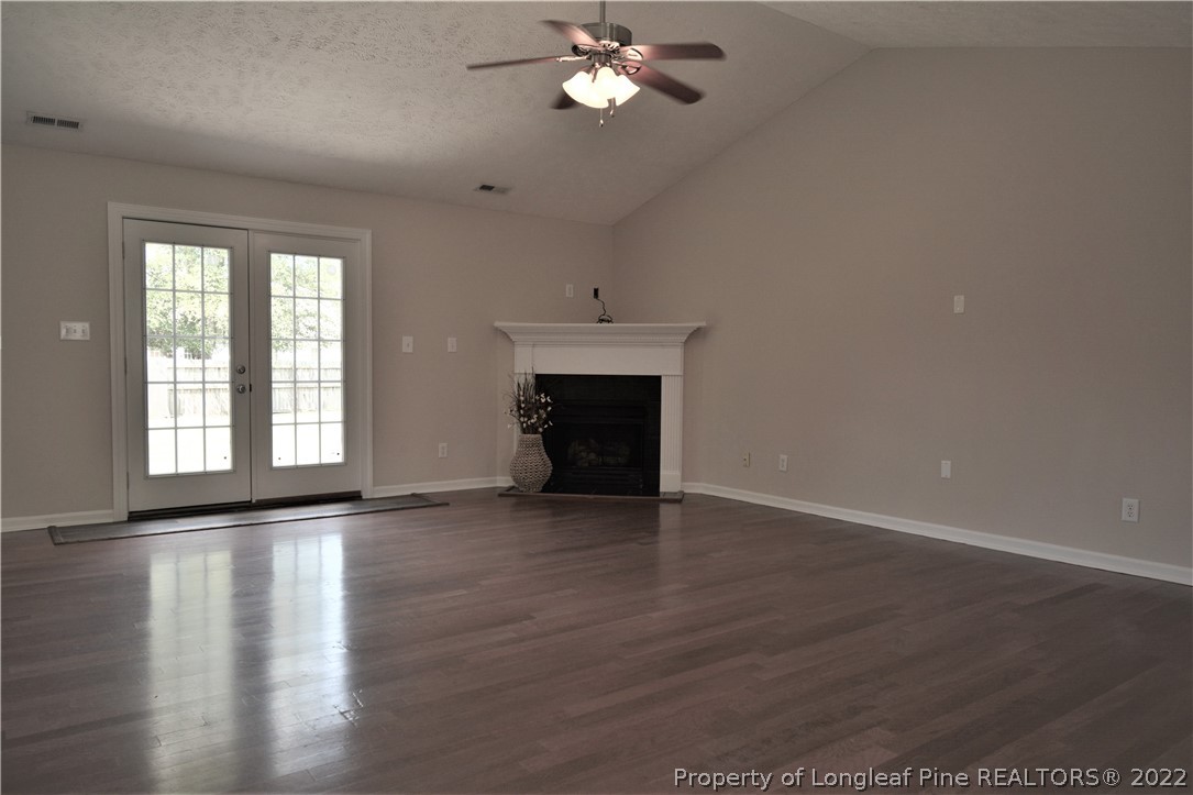 4308 Rocinta Court Hope Mills, NC 28348 - Photo 4 of 23 a view of an empty room with wooden floor and a window