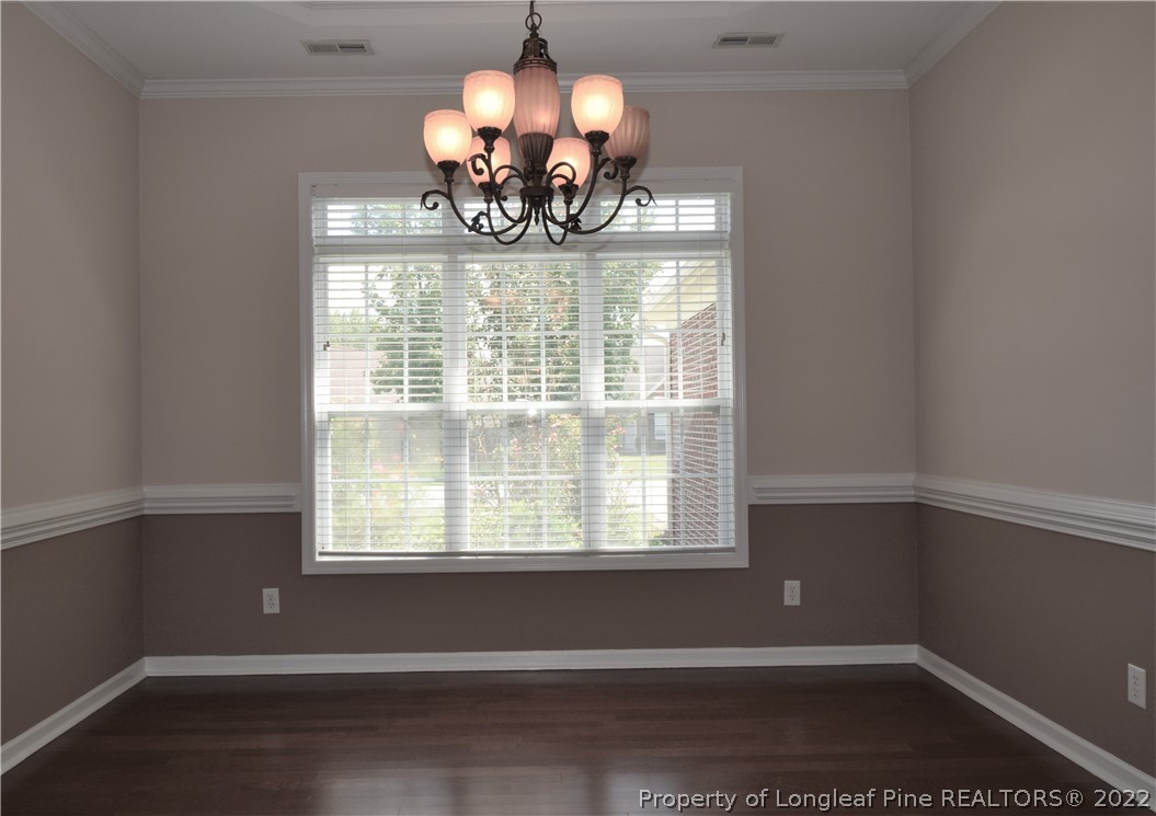 4308 Rocinta Court Hope Mills, NC 28348 - Photo 9 of 23 a view of a dining room with a chandelier