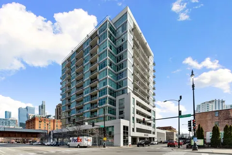 a city street lined with buildings and cars