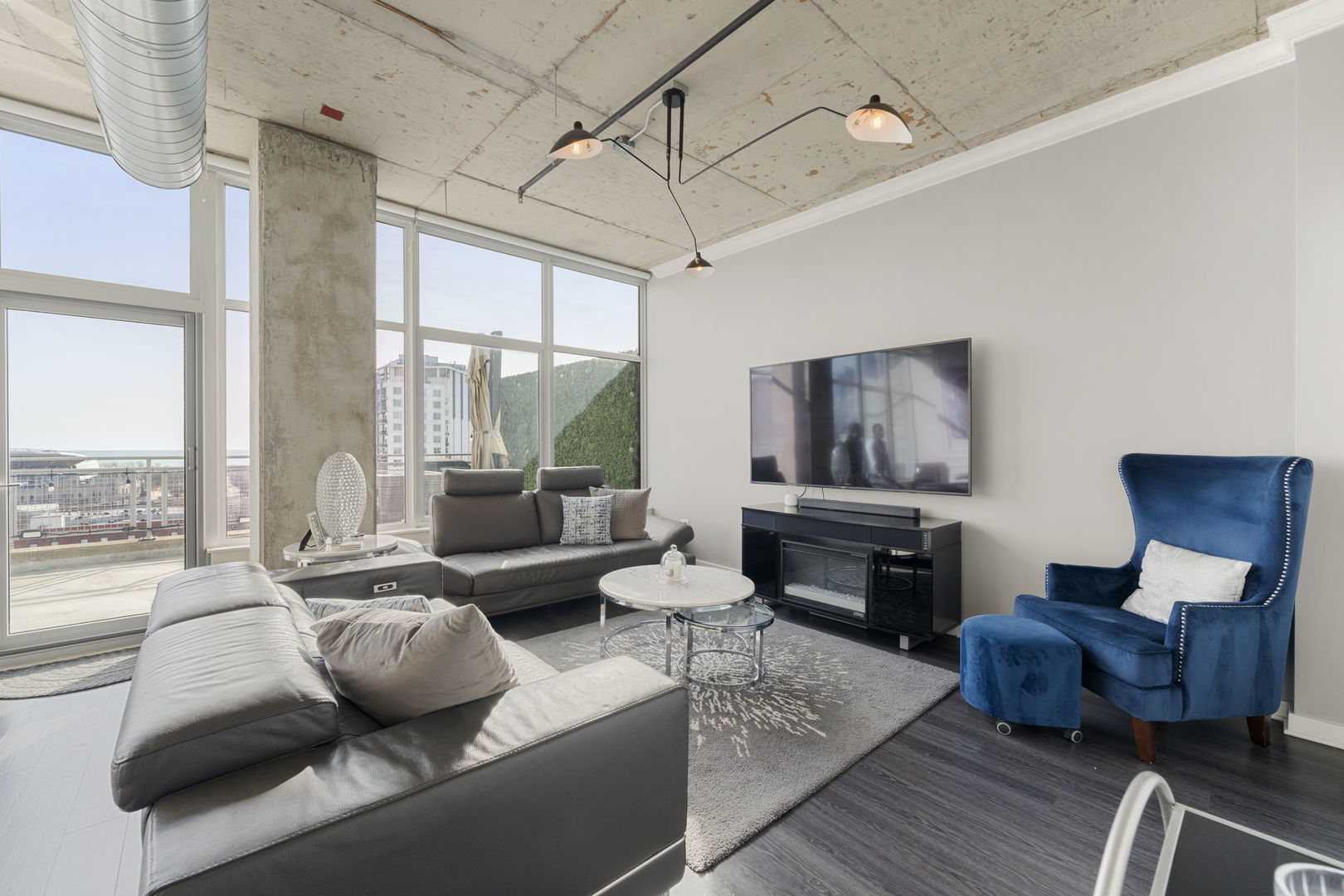 50 East 16th Street, Unit 1405 Chicago, IL 60616 - Photo 12 of 36 a living room with furniture and a fireplace