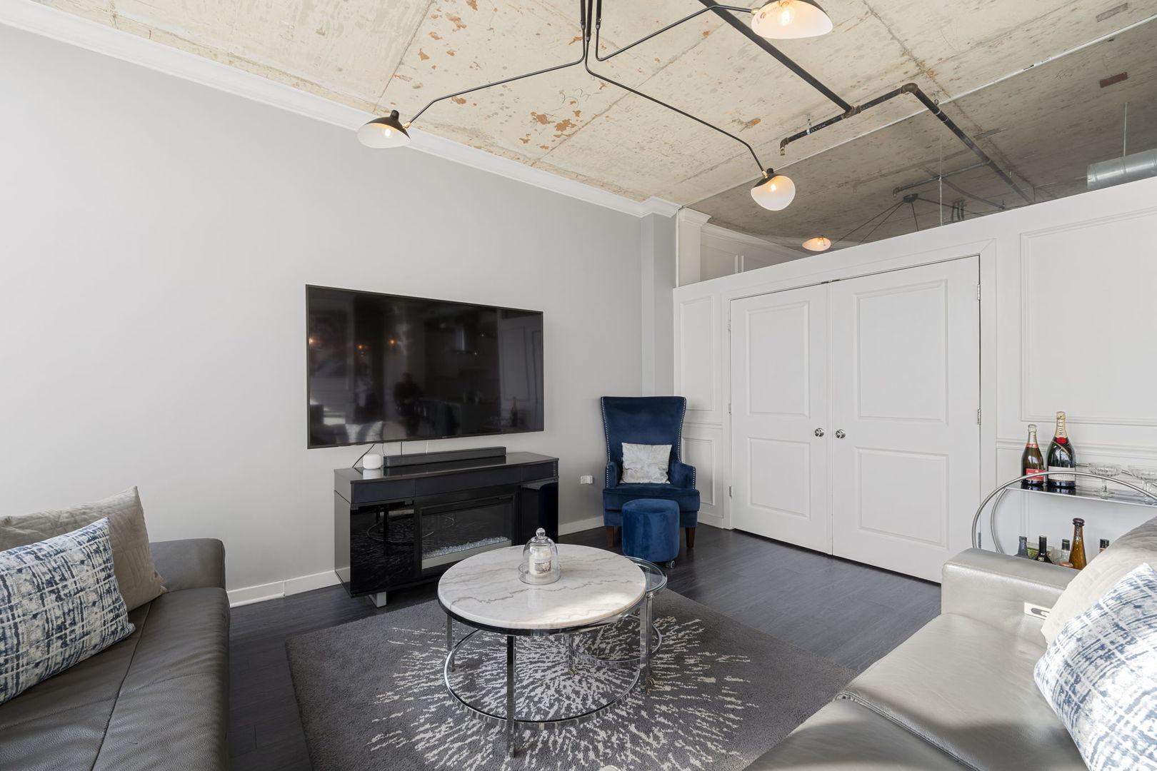 50 East 16th Street, Unit 1405 Chicago, IL 60616 - Photo 13 of 36 a living room with furniture and a flat screen tv