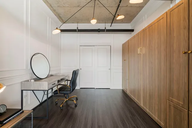 a view of a room with furniture and wooden floor