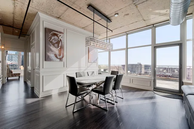 a dining room with furniture window wooden floor