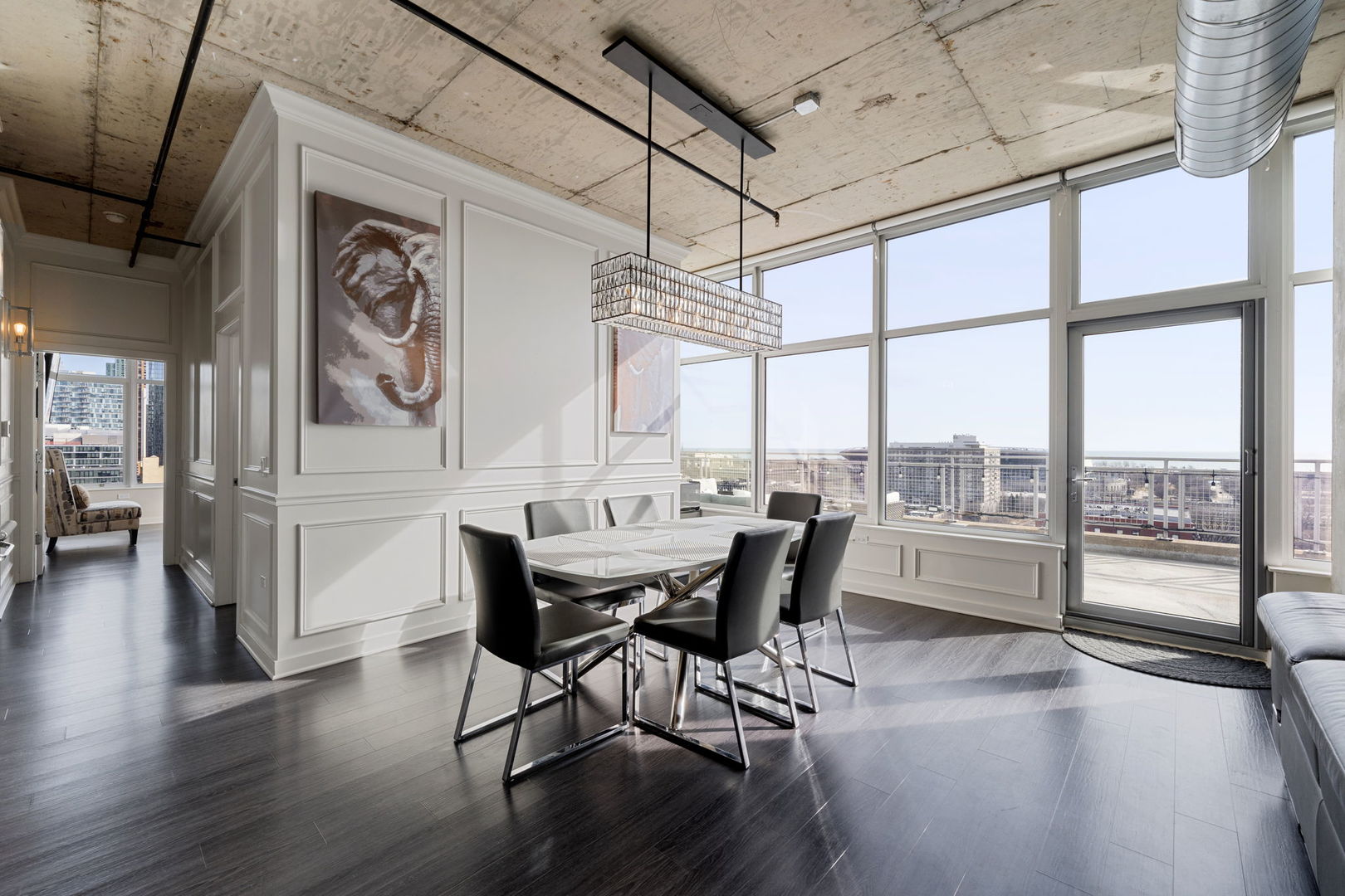 50 East 16th Street, Unit 1405 Chicago, IL 60616 - Photo 19 of 36 a dining room with furniture window wooden floor