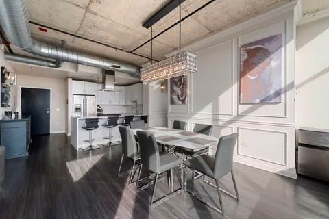 a view of a dining room with furniture and wooden floor