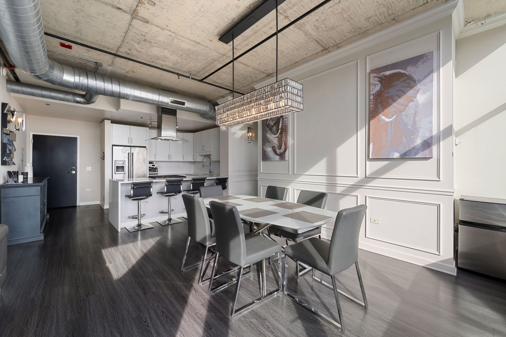 50 East 16th Street, Unit 1405 Chicago, IL 60616 - Photo 20 of 36 a view of a dining room with furniture and wooden floor