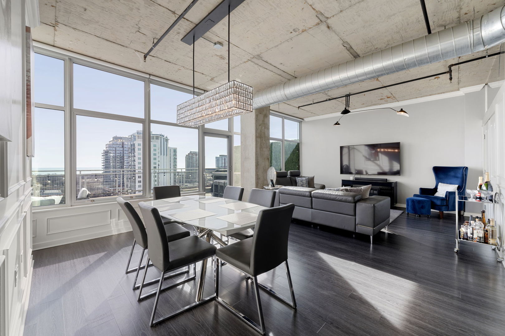 50 East 16th Street, Unit 1405 Chicago, IL 60616 - Photo 2 of 36 a dining room with furniture window and wooden floor