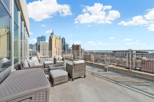 a view of roof deck with patio
