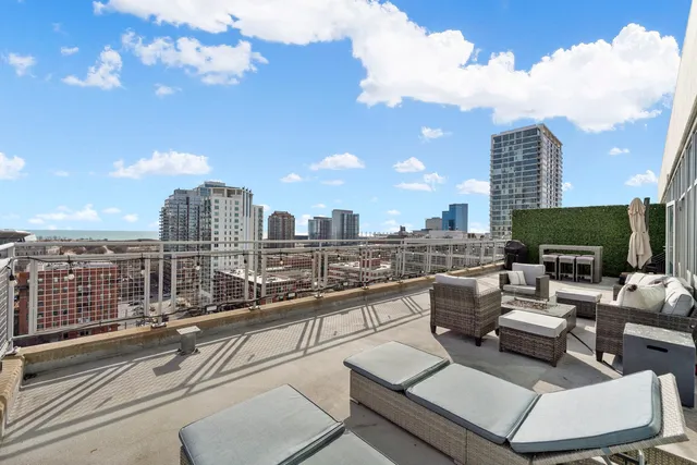 a view of a terrace with couches and potted plants