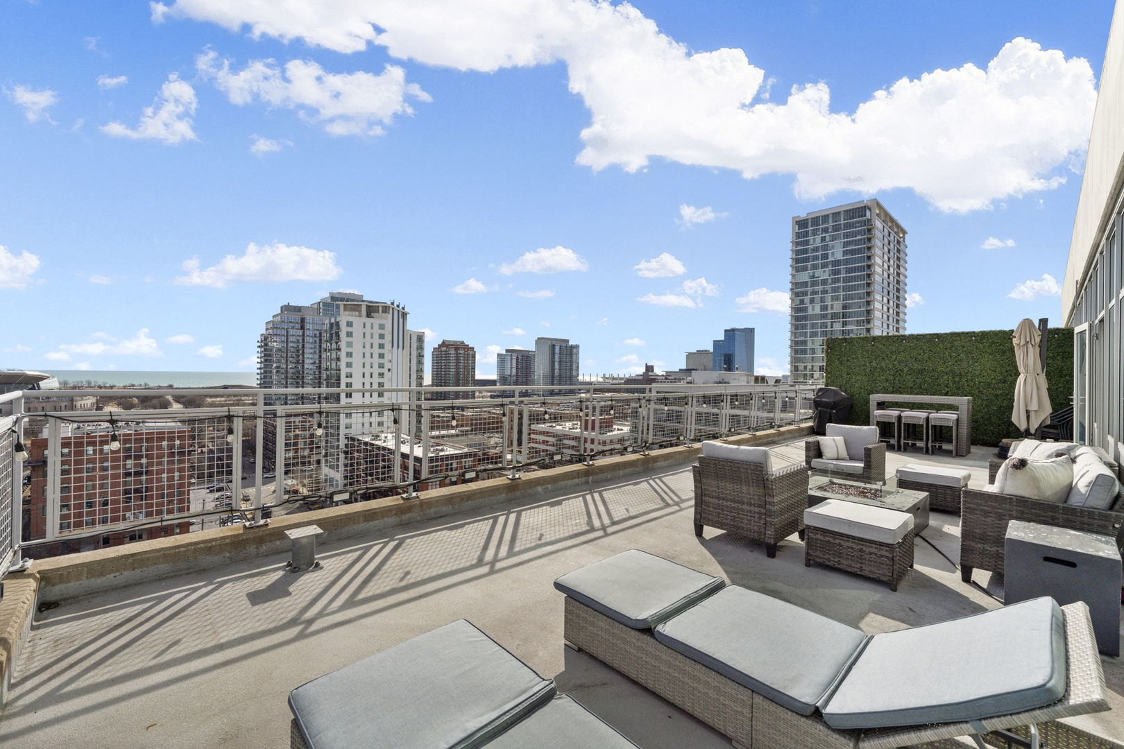 50 East 16th Street, Unit 1405 Chicago, IL 60616 - Photo 30 of 36 a view of a terrace with couches and potted plants