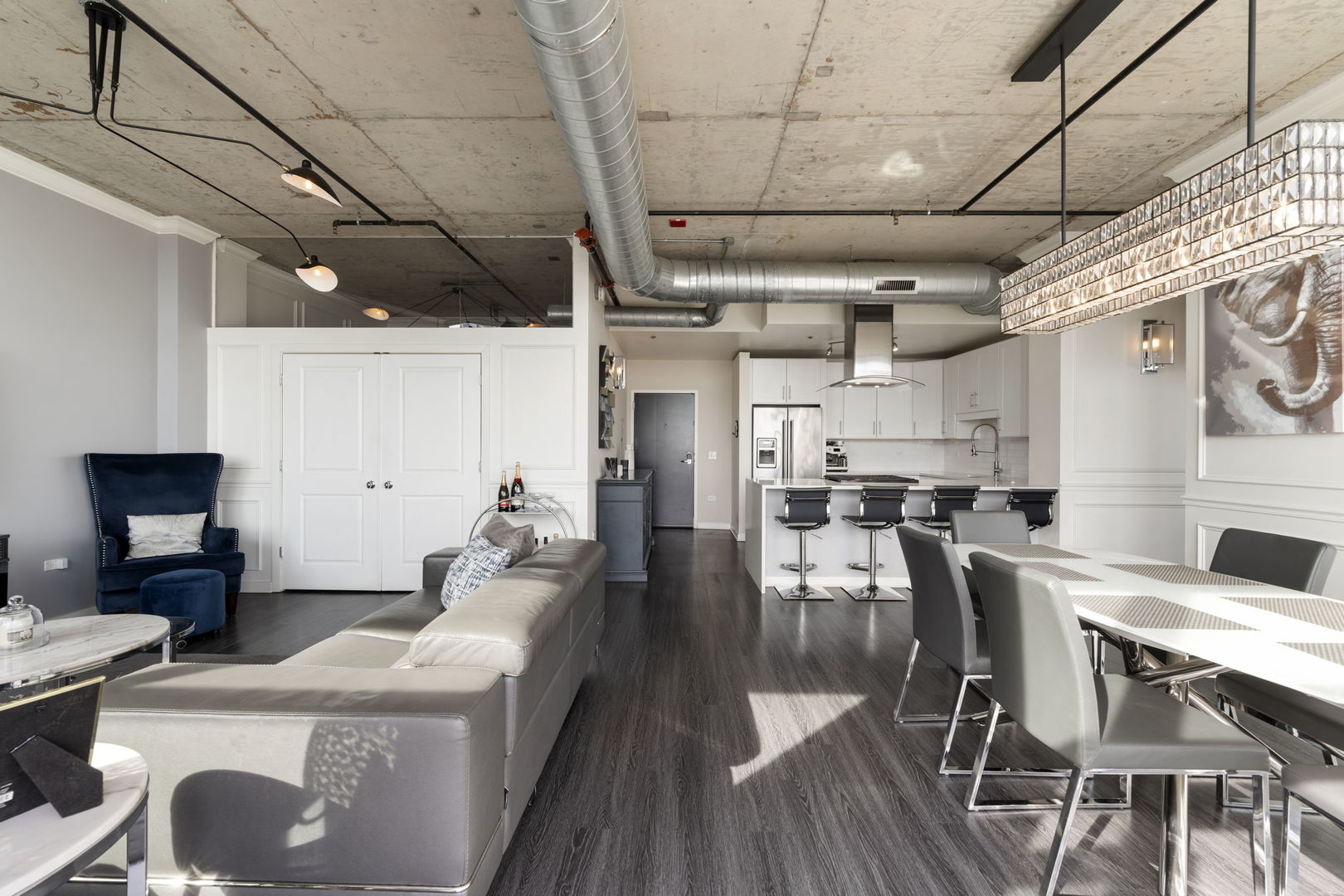 50 East 16th Street, Unit 1405 Chicago, IL 60616 - Photo 3 of 36 a living room with stainless steel appliances furniture stove rug and a kitchen view