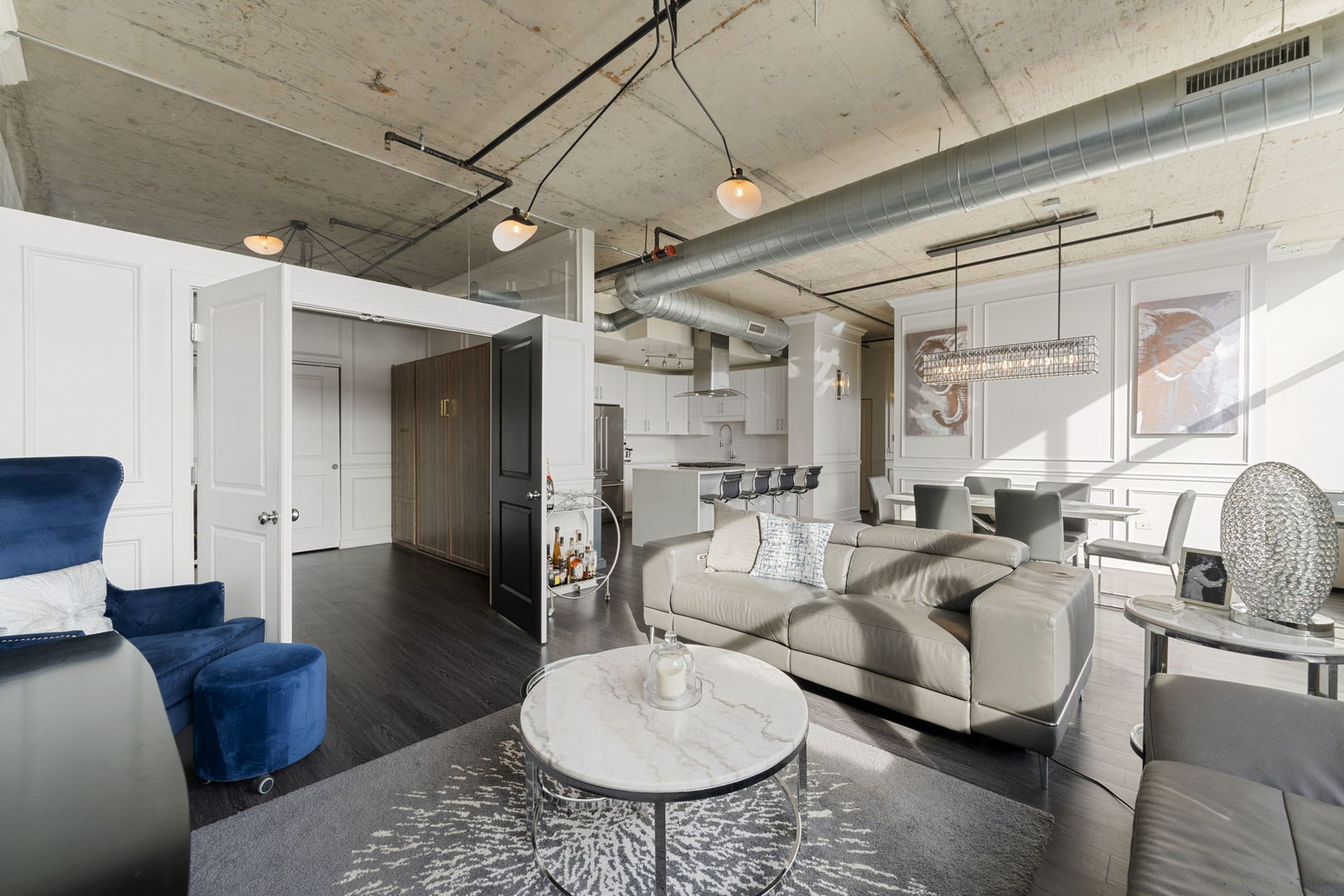50 East 16th Street, Unit 1405 Chicago, IL 60616 - Photo 5 of 36 a living room with furniture a rug and a large window
