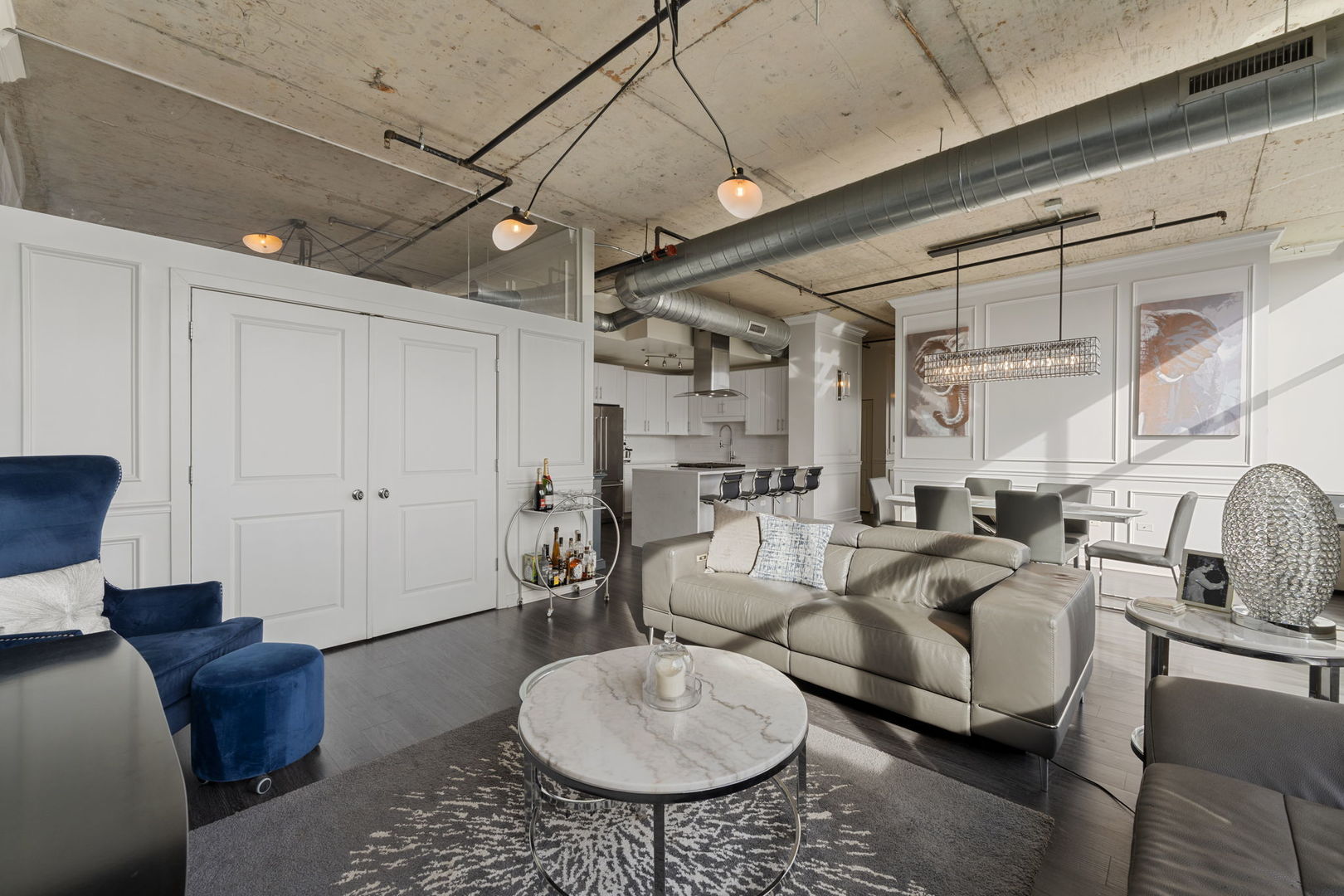 50 East 16th Street, Unit 1405 Chicago, IL 60616 - Photo 6 of 36 a living room with furniture a rug and white walls