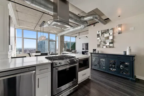 a kitchen with a stove and a sink