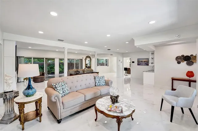 a view of a dining room with furniture and a window