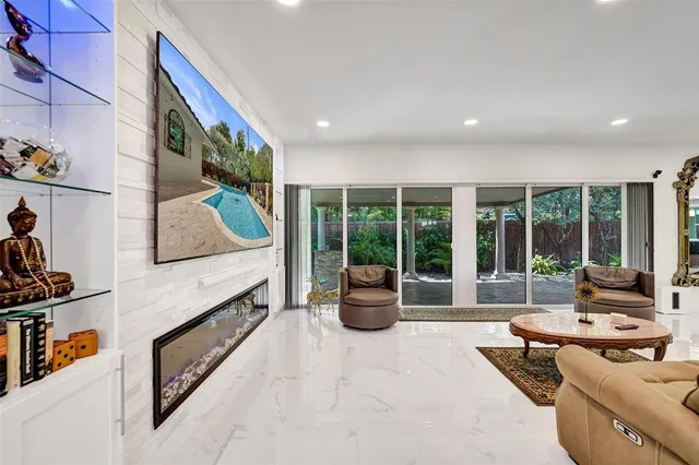 a view of a livingroom with furniture and a window