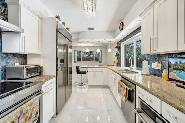 a view of a backyard with wooden fence