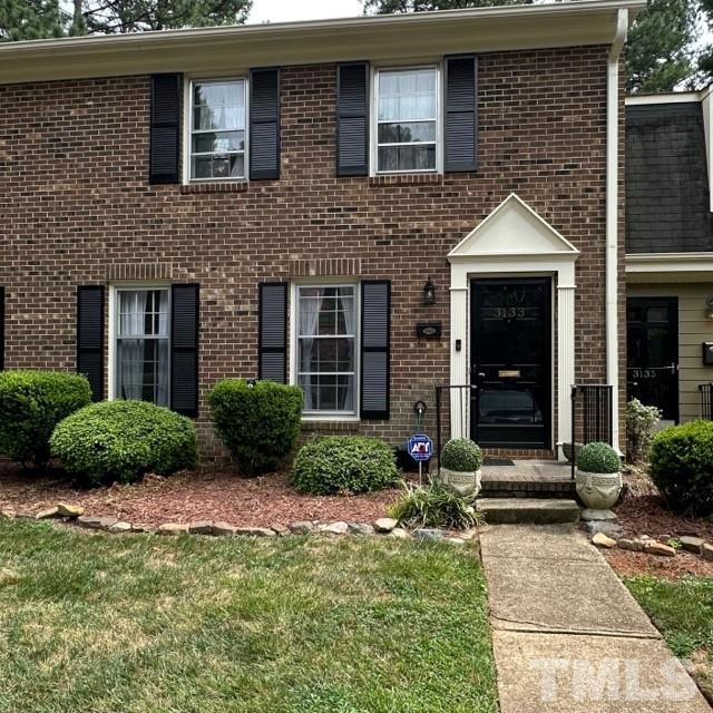 3133 Morningside Drive Raleigh, NC 27607 - Photo 1 of 3 a front view of a house with garden