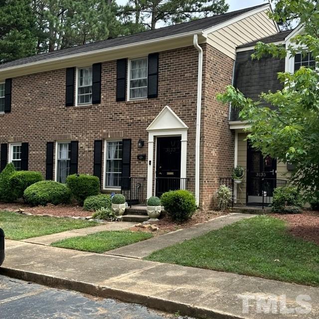 3133 Morningside Drive Raleigh, NC 27607 - Photo 3 of 3 a front view of a house with a yard