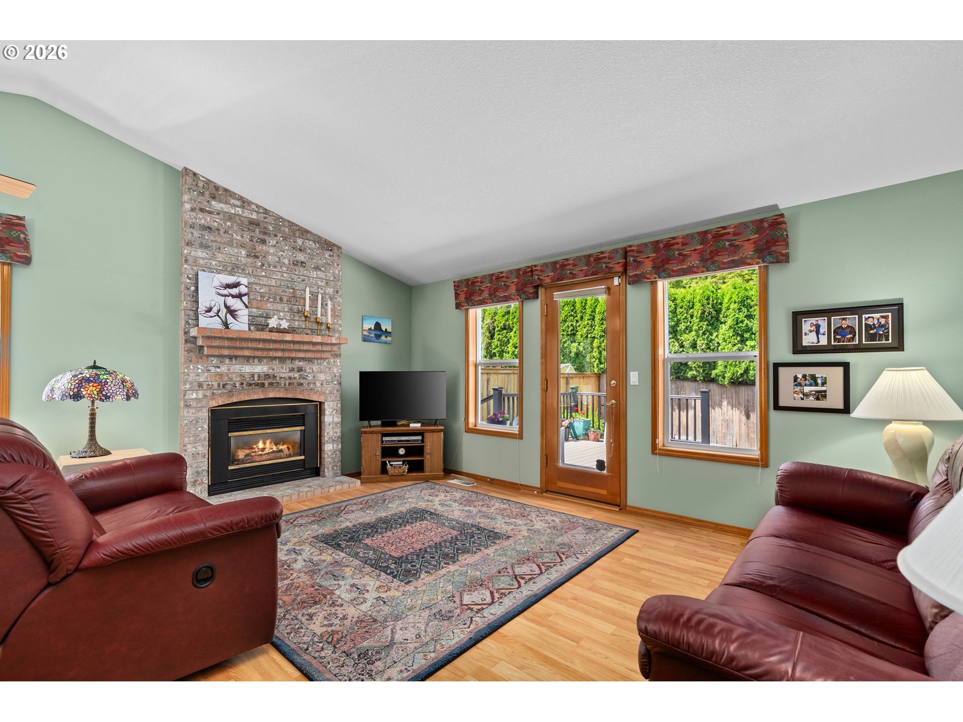 3081 Southwest 31st Street Gresham, OR 97080 - Photo 30 of 38 a living room with furniture large window and a fireplace