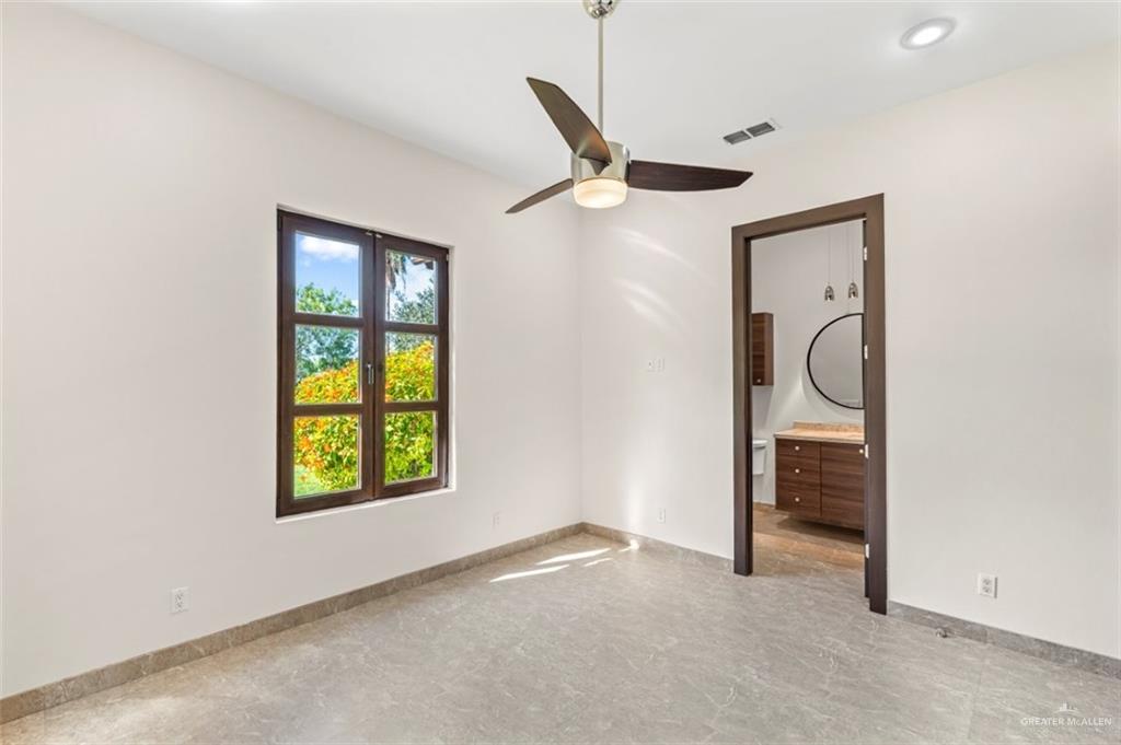 1421 Encanto Road, Unit SERVICE Weslaco, TX 78596 - Photo 24 of 37 an empty room with windows and closet