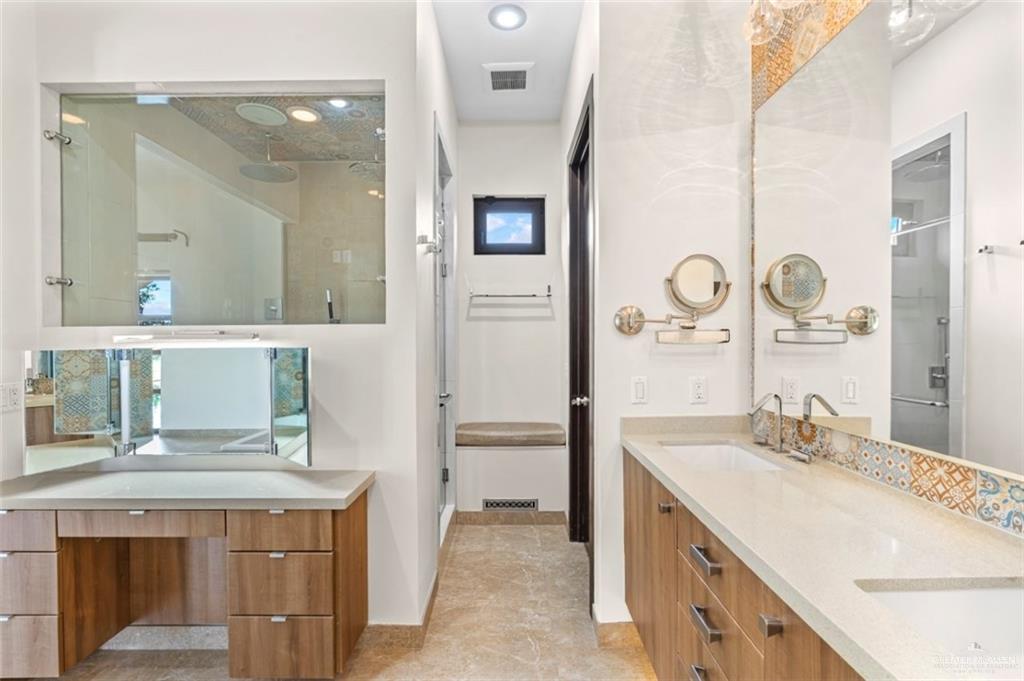 1421 Encanto Road, Unit SERVICE Weslaco, TX 78596 - Photo 29 of 37 a bathroom with a sink a vanity and a mirror