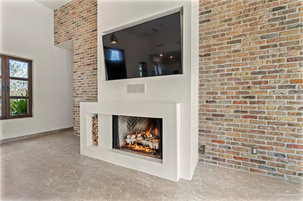 1421 Encanto Road, Unit SERVICE Weslaco, TX 78596 - Photo 35 of 37 a view of a livingroom with a fireplace