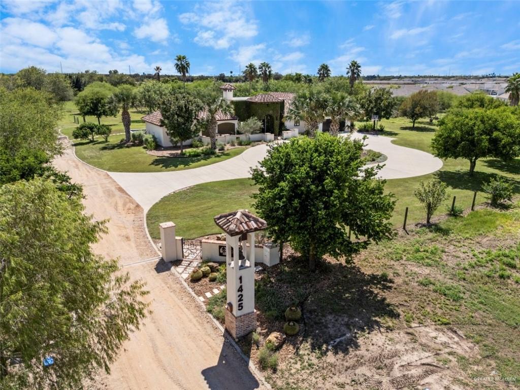 1421 Encanto Road, Unit SERVICE Weslaco, TX 78596 - Photo 4 of 37 a view of a garden with an outdoor space