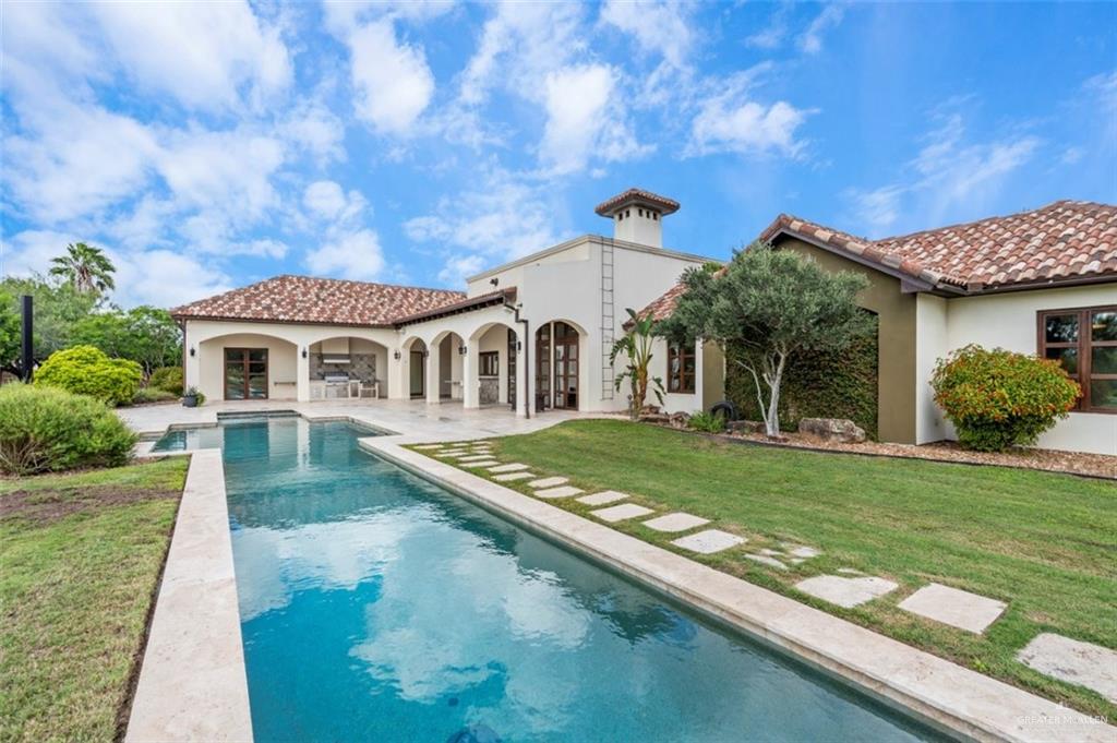 1421 Encanto Road, Unit SERVICE Weslaco, TX 78596 - Photo 7 of 37 a front view of a house with garden