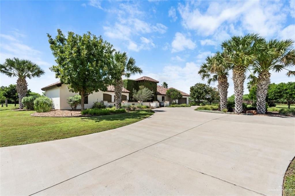 1421 Encanto Road, Unit SERVICE Weslaco, TX 78596 - Photo 10 of 37 a view of a house with a yard