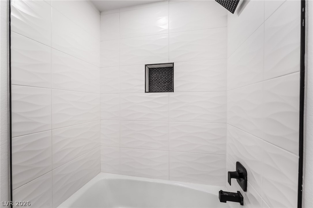429 Crestway Road Henderson, NV 89015 - Photo 40 of 56 A pristine tiled shower with a convenient recessed niche awaits your personal touches.