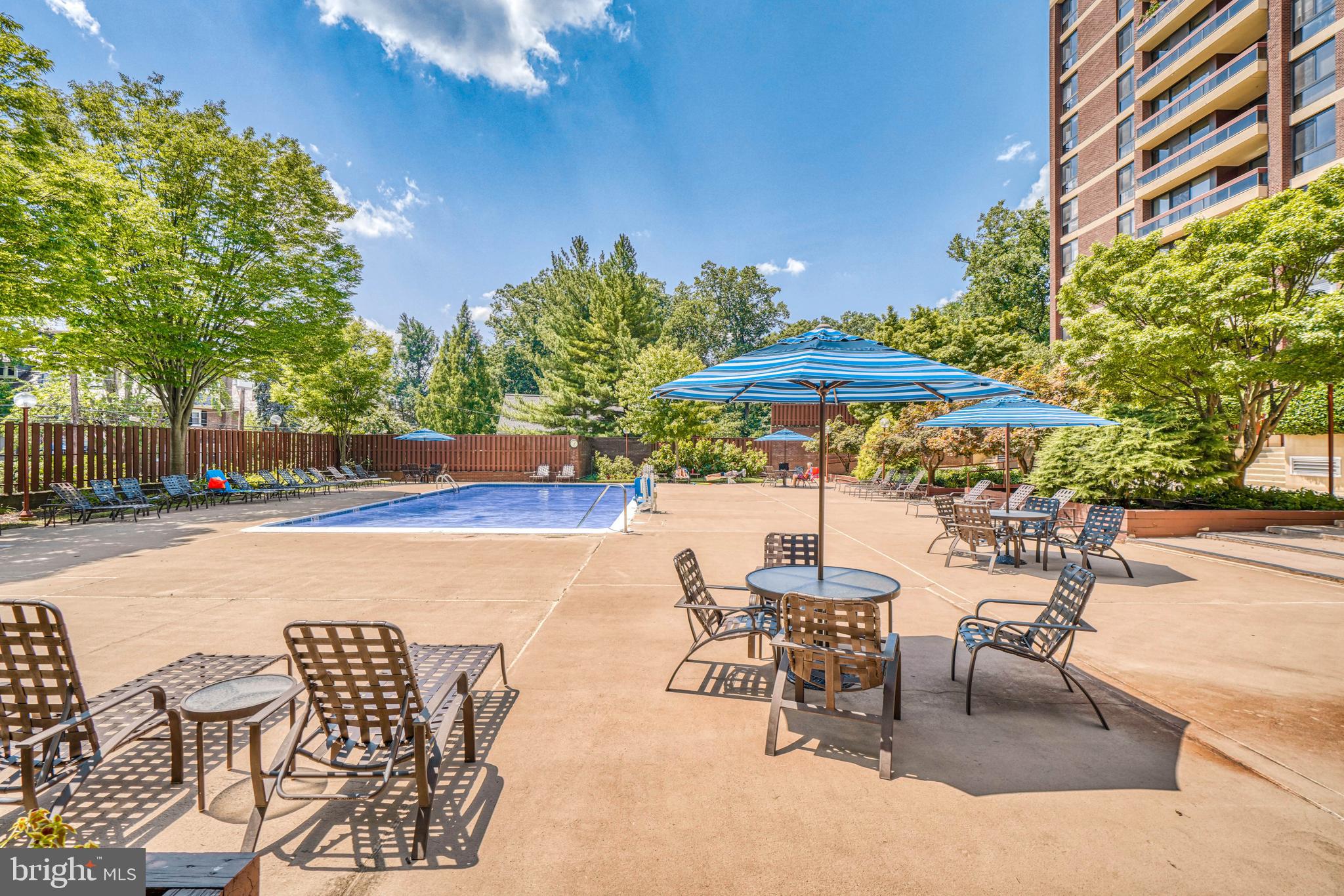4100 North Charles Street, Unit 412 Baltimore, MD 21218 - Photo 42 of 56 Lounging and landscaped area around pool.