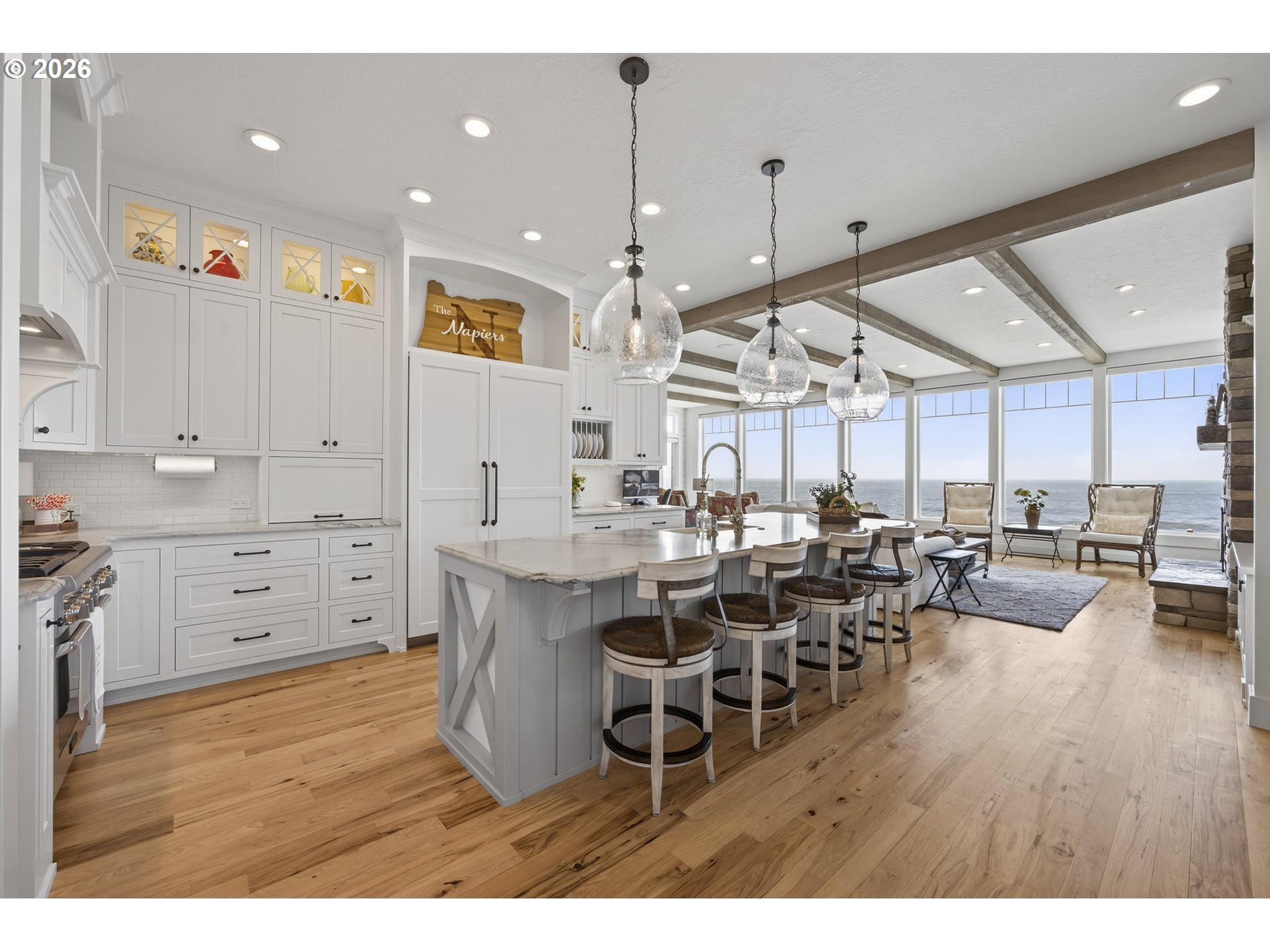 525 Point Avenue Depoe Bay, OR 97341 - Photo 12 of 47 a room with lots of wooden furniture and a chandelier