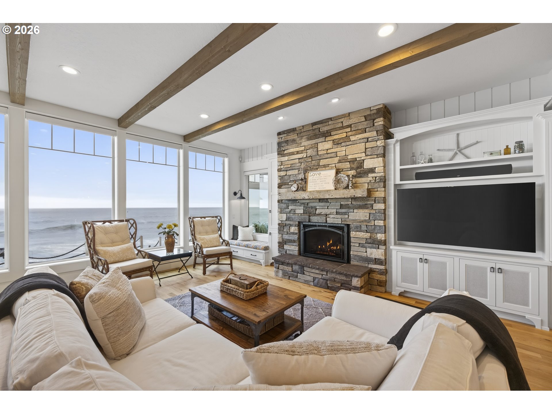 525 Point Avenue Depoe Bay, OR 97341 - Photo 16 of 47 a living room with furniture a flat screen tv and a fireplace