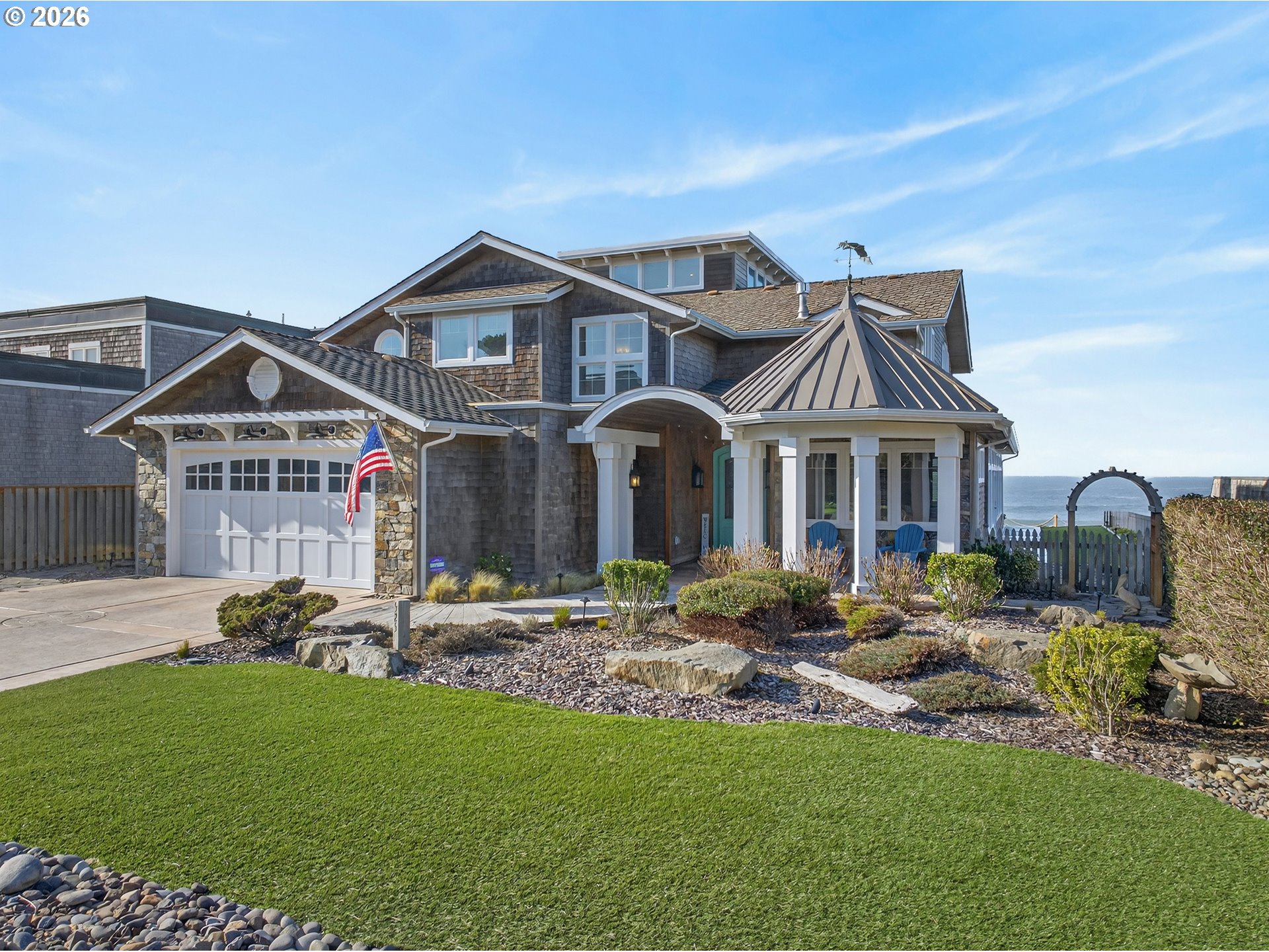 525 Point Avenue Depoe Bay, OR 97341 - Photo 2 of 47 a front view of house with yard outdoor seating and barbeque oven