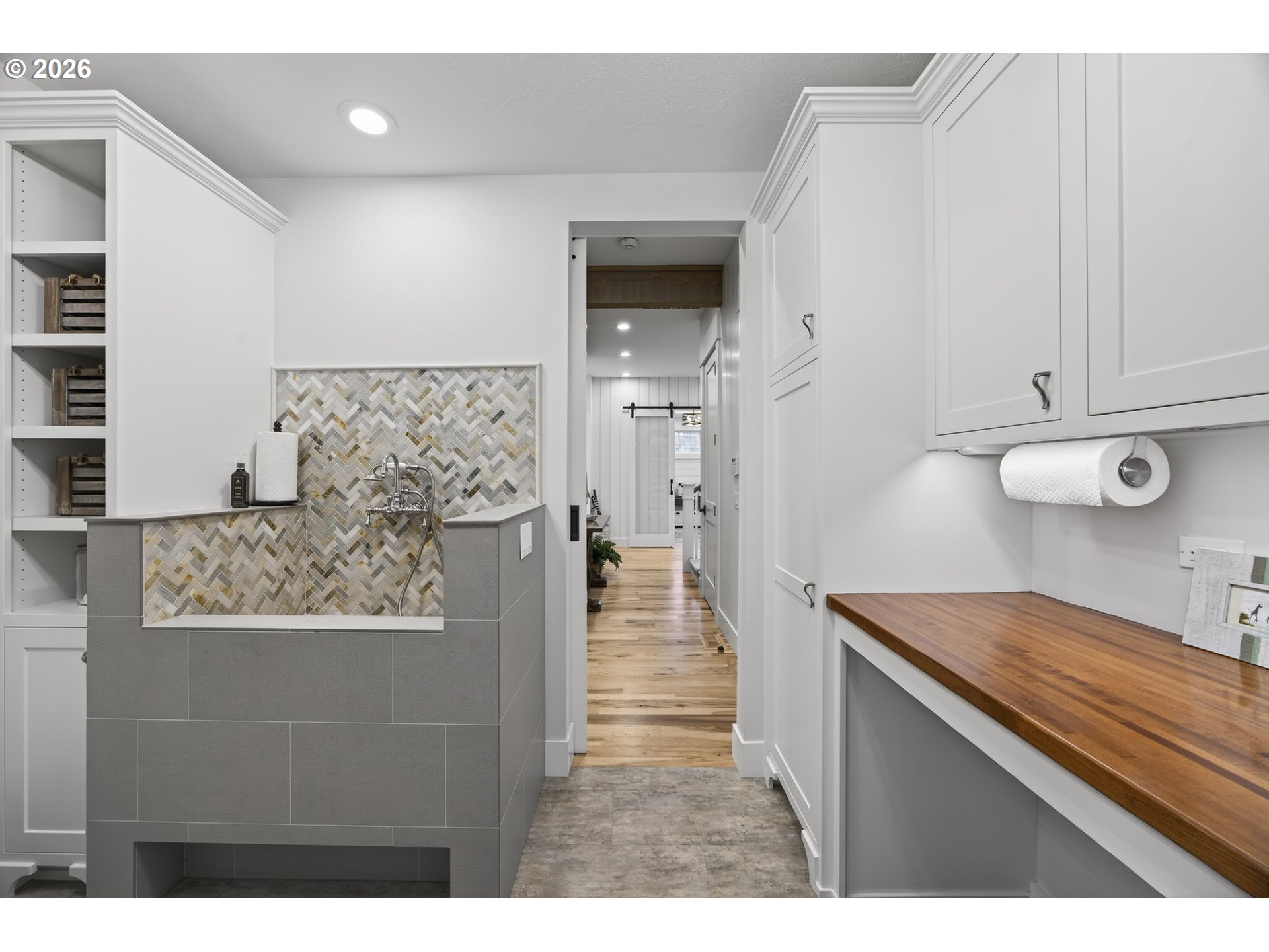 525 Point Avenue Depoe Bay, OR 97341 - Photo 21 of 47 a hallway with a view of kitchen and wooden floor
