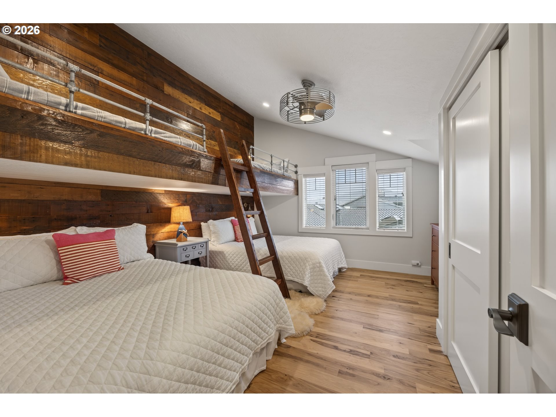 525 Point Avenue Depoe Bay, OR 97341 - Photo 24 of 47 a bedroom with a bed and wooden floor