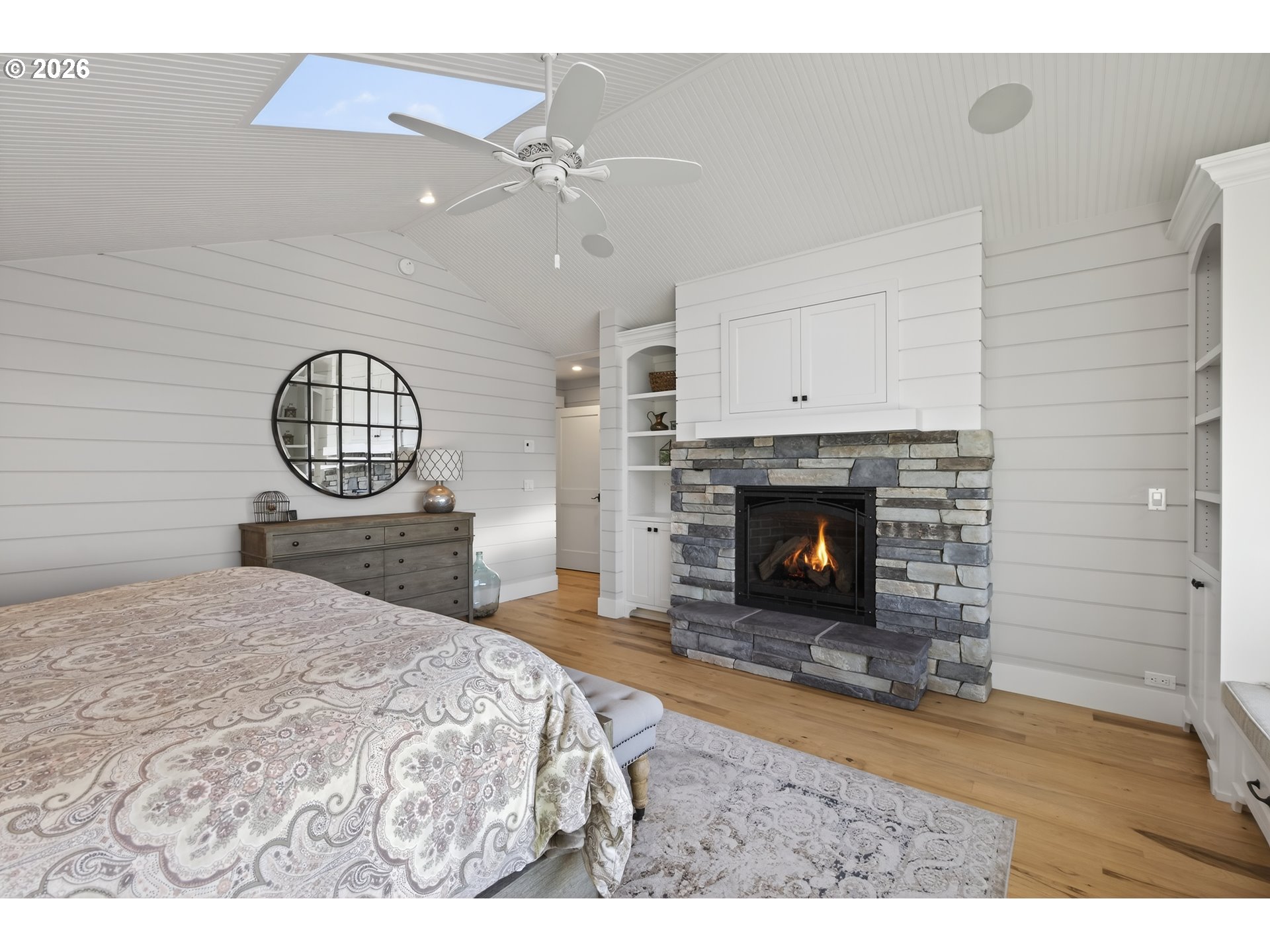 525 Point Avenue Depoe Bay, OR 97341 - Photo 36 of 47 a view of a livingroom with a fireplace a chandelier and windows