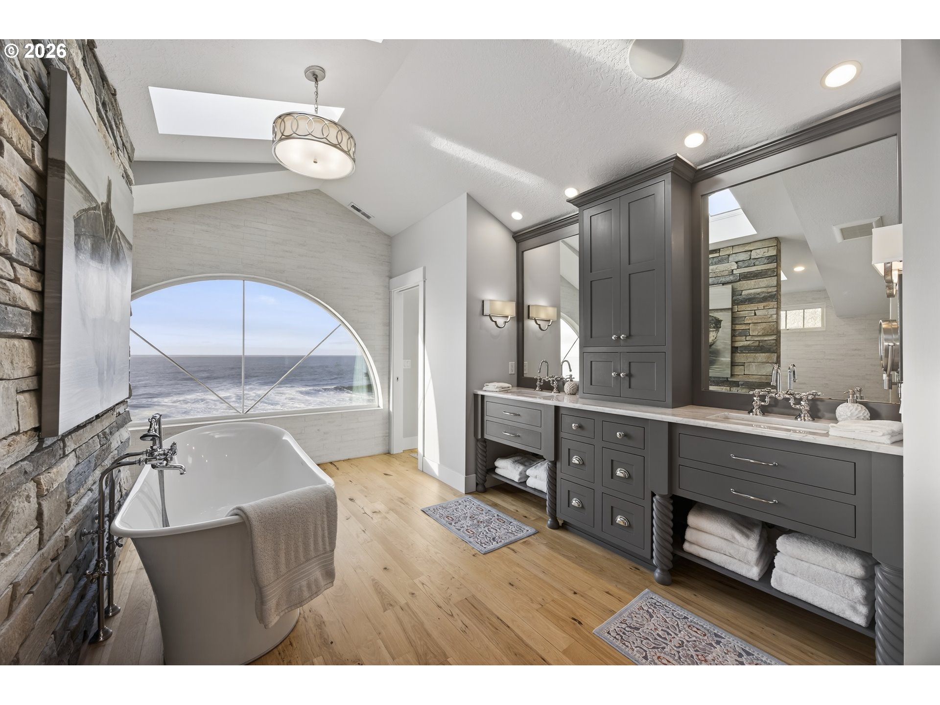 525 Point Avenue Depoe Bay, OR 97341 - Photo 37 of 47 a bathroom with a sink mirror and a bathtub