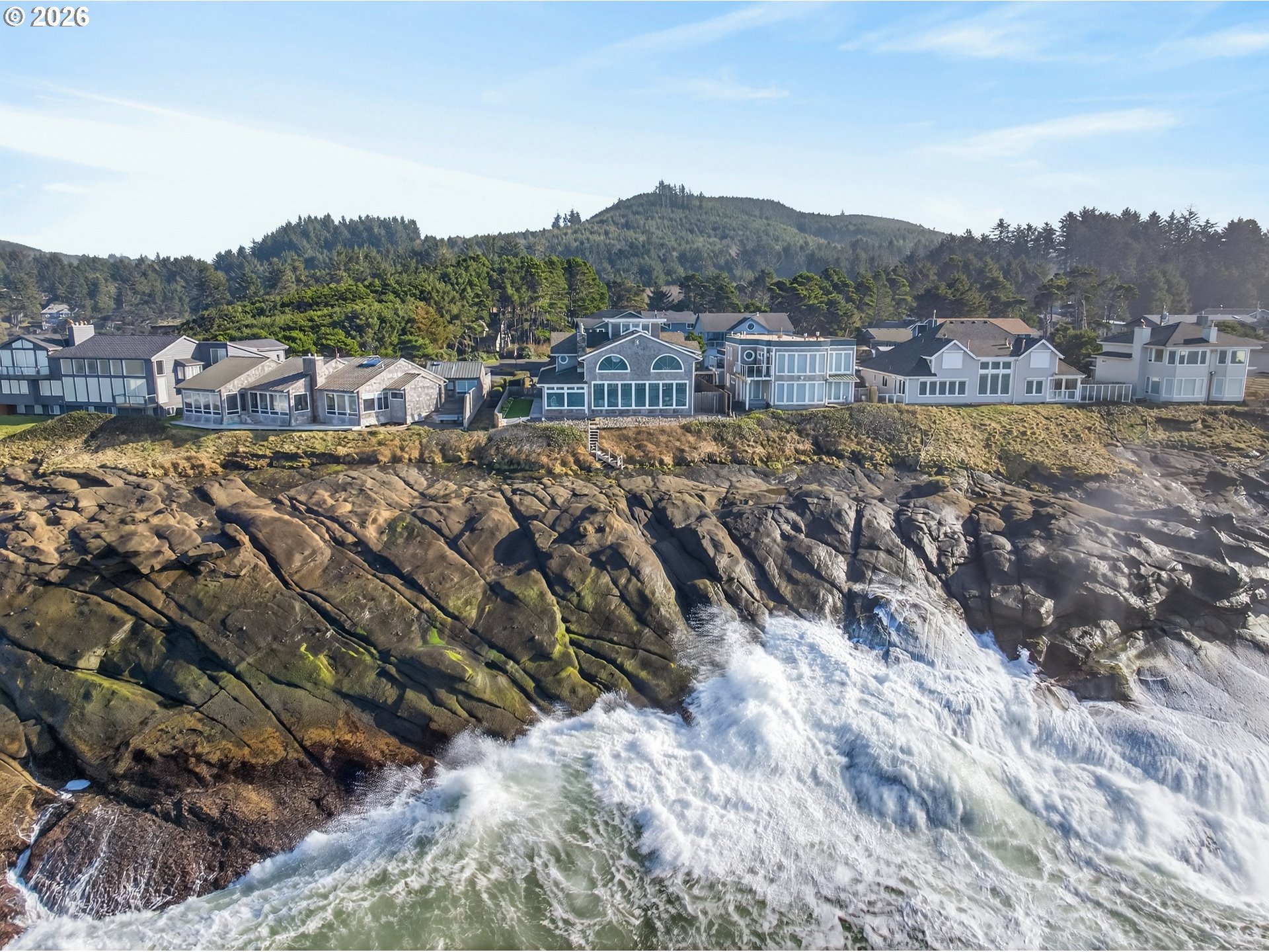 525 Point Avenue Depoe Bay, OR 97341 - Photo 45 of 47 a view of a town with mountains in the background