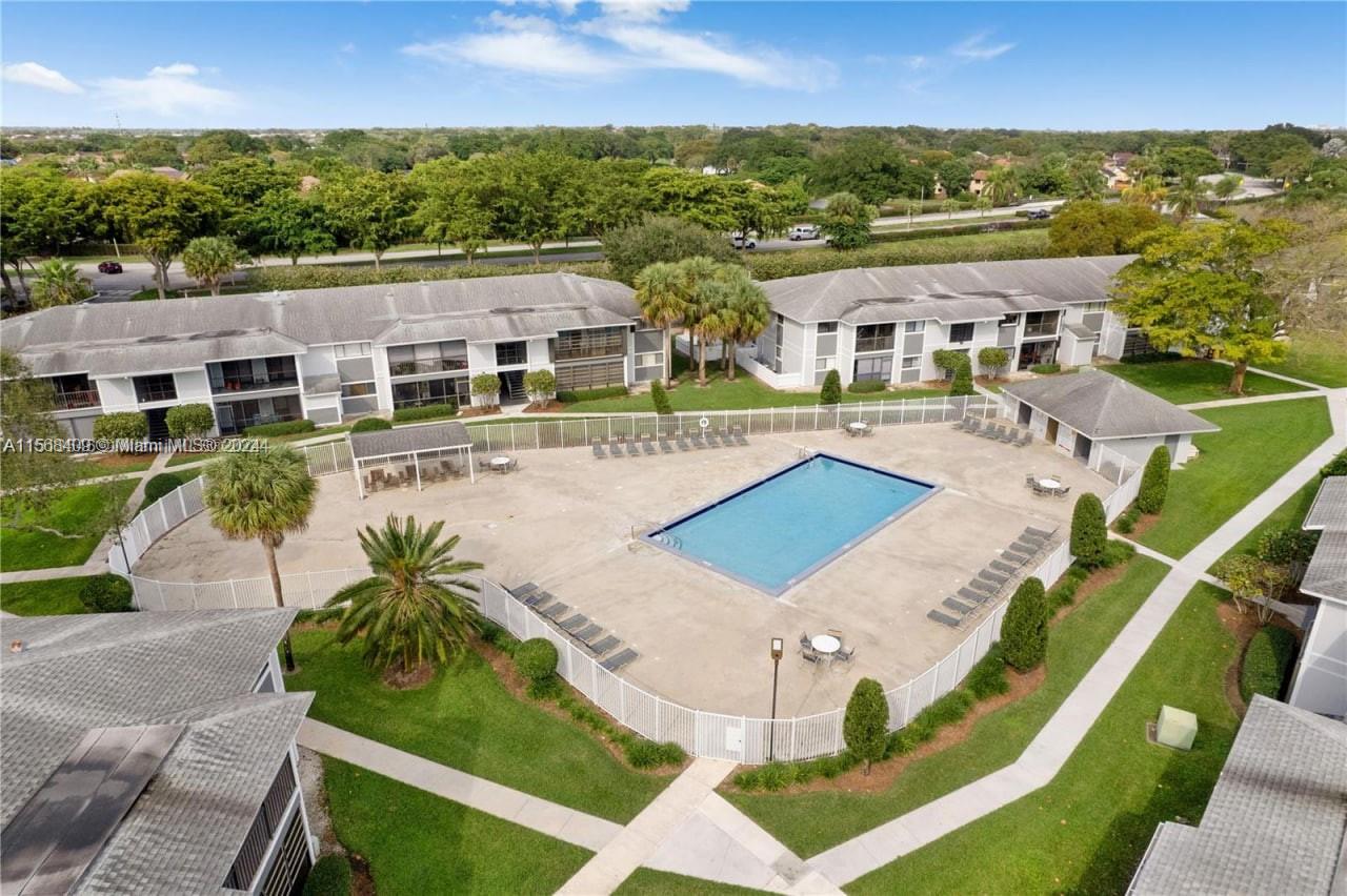 9701 Hammocks Boulevard, Unit 108A Miami, FL 33196 - Photo 5 of 8 an aerial view of residential houses with outdoor space and trees