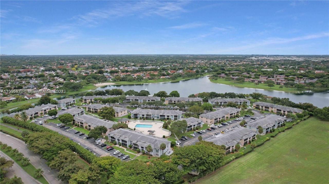 9701 Hammocks Boulevard, Unit 108A Miami, FL 33196 - Photo 7 of 8 an aerial view of a city with lots of residential buildings