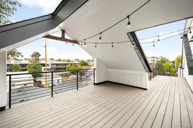 a view of a balcony with wooden floor