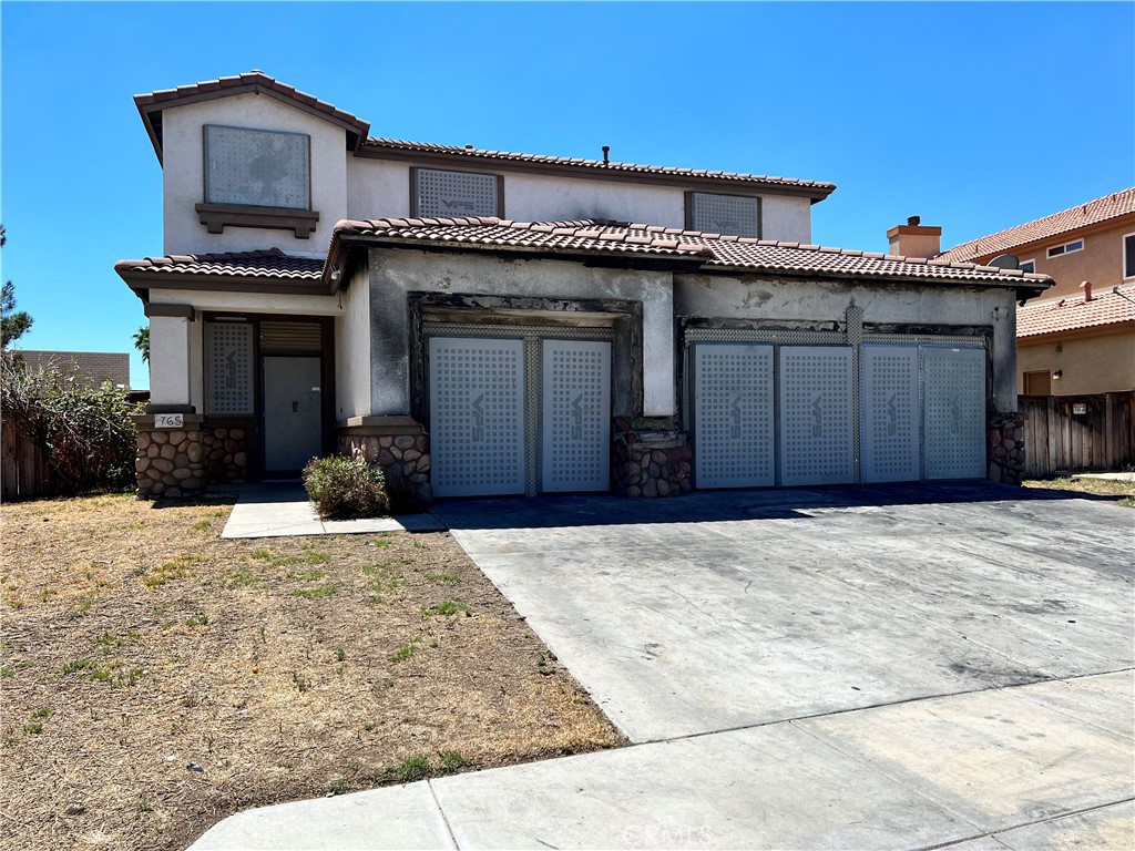 765 Sweet Clover Loop San Jacinto, CA 92582 - Photo 1 of 1 a view of a house with a yard and garage