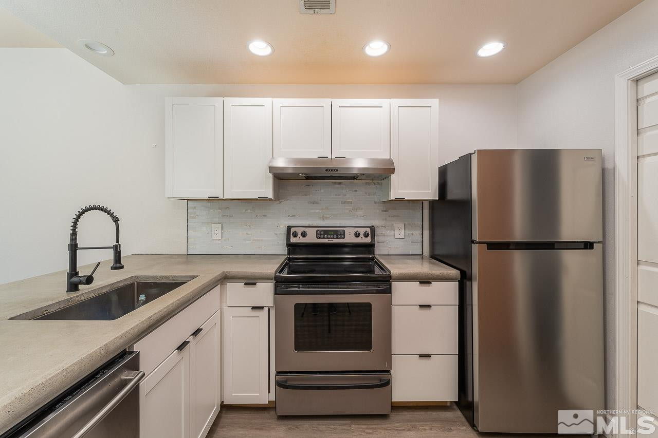 326 East 7th Street Reno, NV 89512 - Photo 2 of 21 a kitchen with a stove sink and refrigerator