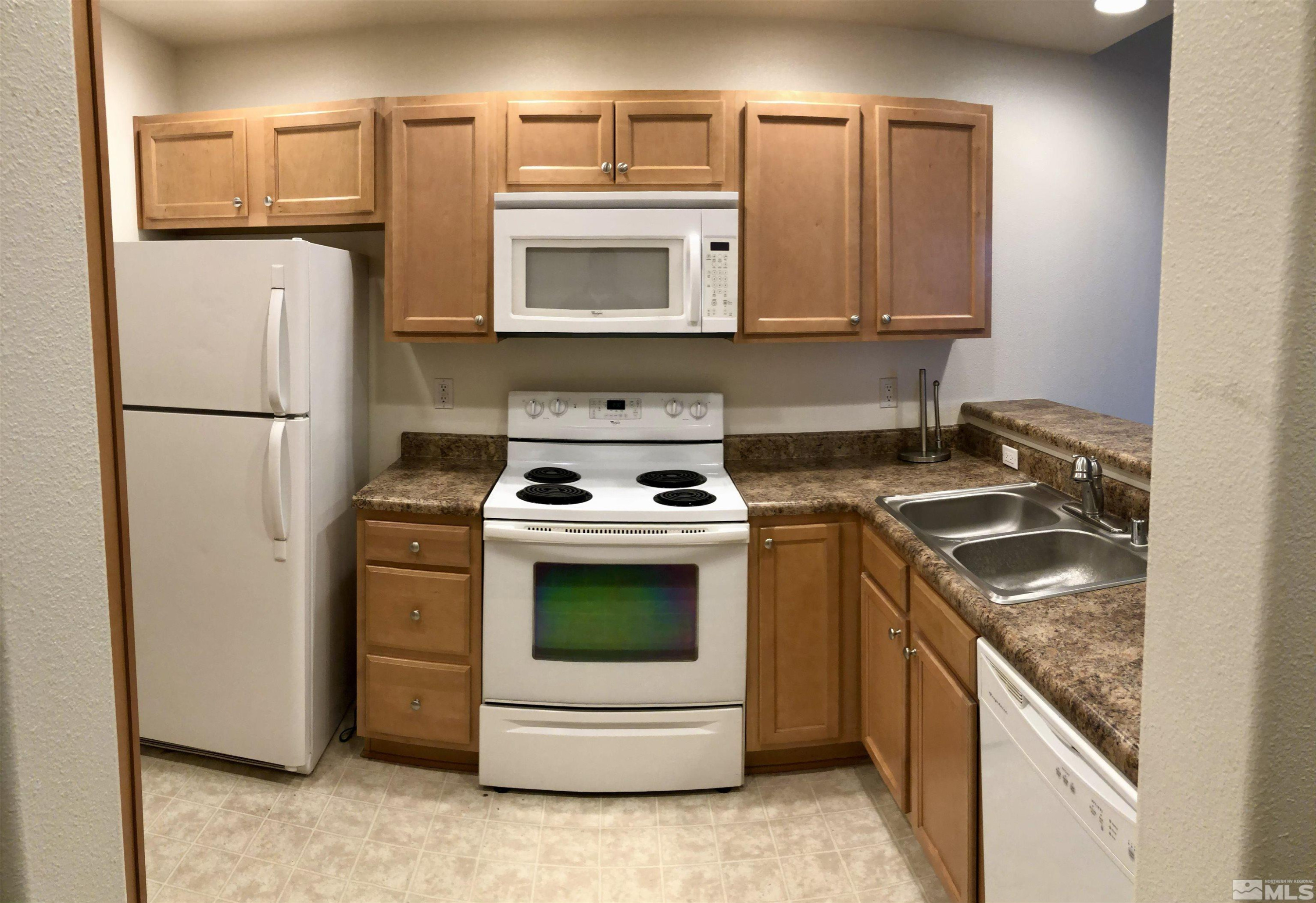 326 East 7th Street Reno, NV 89512 - Photo 9 of 21 a kitchen with a stove and a refrigerator