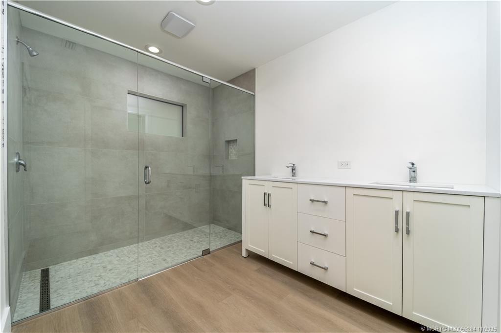 5549 Southeast Normandy Avenue Stuart, FL 34997 - Photo 11 of 21 a bathroom with a shower and a sink