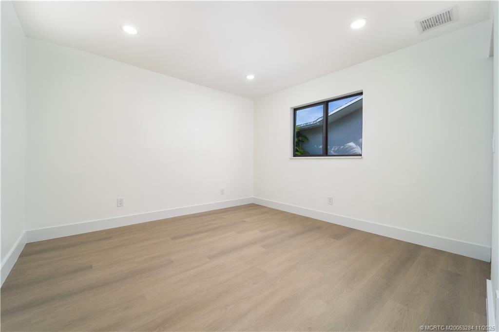 5549 Southeast Normandy Avenue Stuart, FL 34997 - Photo 16 of 21 an empty room with a workbench