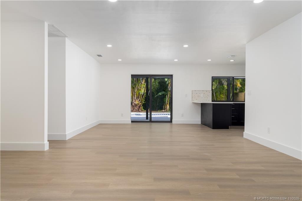 5549 Southeast Normandy Avenue Stuart, FL 34997 - Photo 6 of 21 a view of an empty room with a window