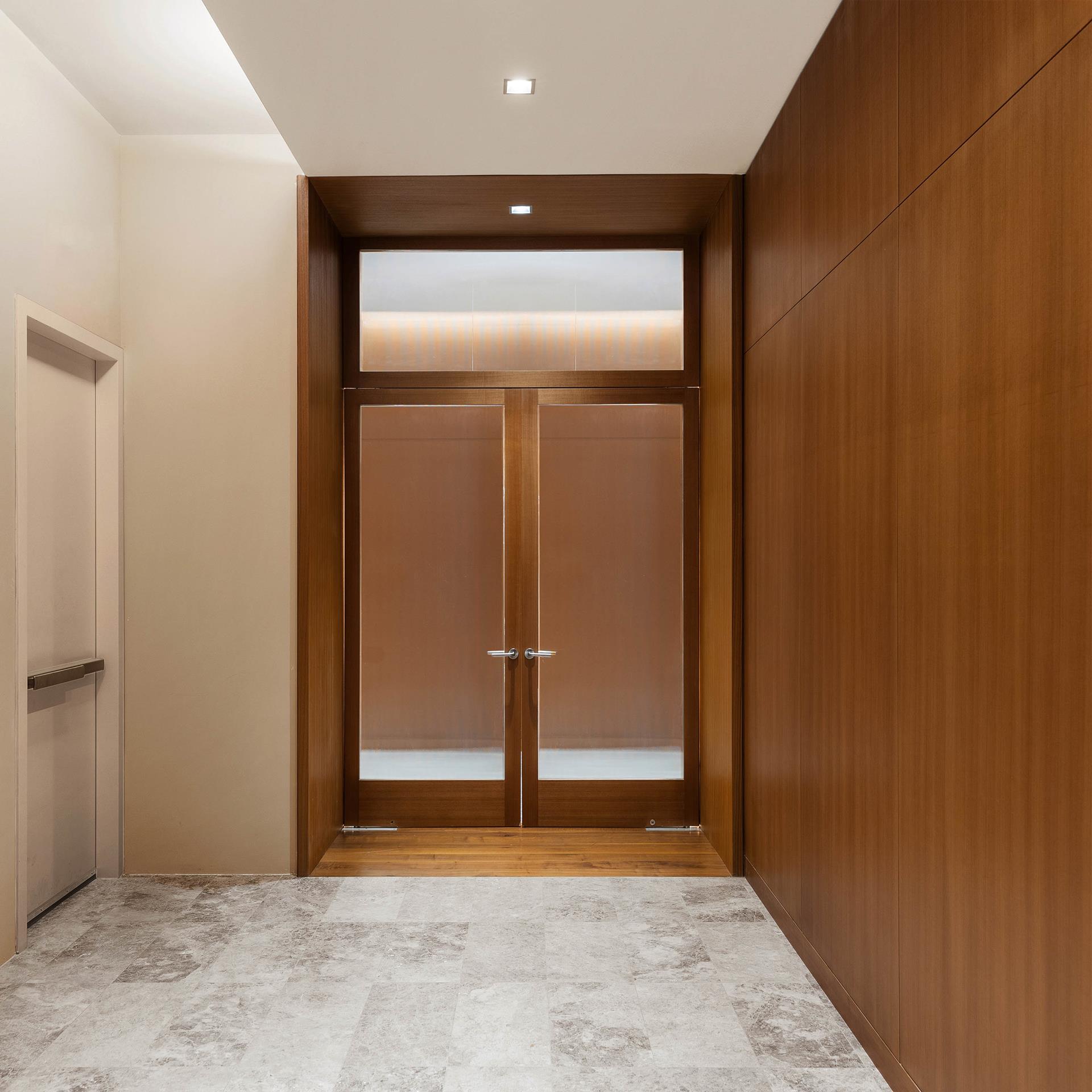 611 West 56th Street, Unit 3A Manhattan, NY 10019 - Photo 13 of 23 en empty room with a door